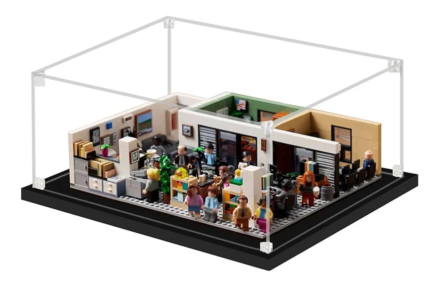 LEGO model of a office scene with characters and furniture inside a clear display case